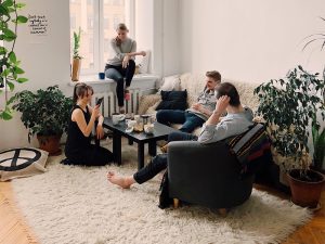 A group of friends sitting in a living room