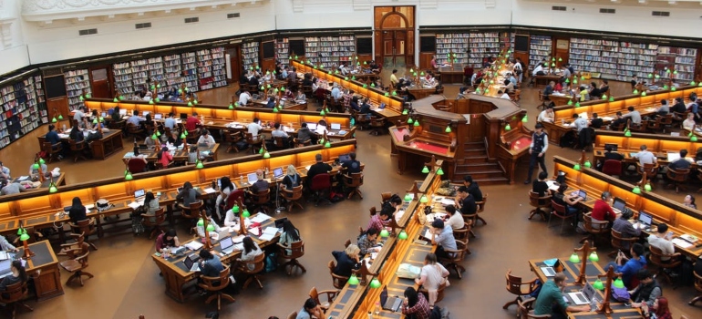students in a big library
