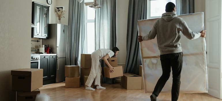 A man carrying a painting