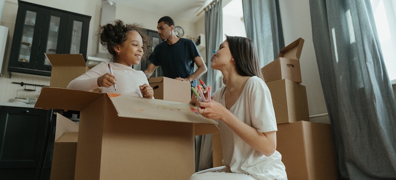 a family utilizing practices for budget-friendly packing for Manhattan storage