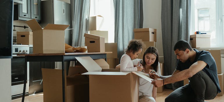 A family packing boxes for storage