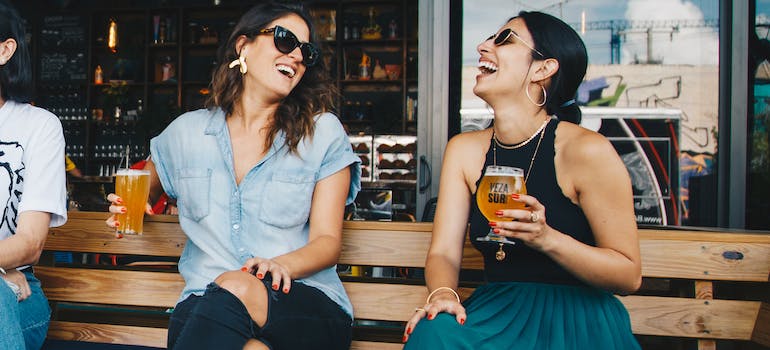 Friends at a cafe and bar in one of the top Manhattan neighborhoods for young couples