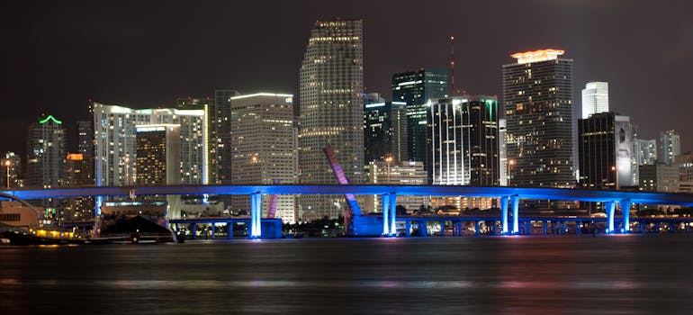Buildings in Miami - one of the top cities that Manhattan residents are moving to - at night