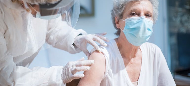 A senior getting a shot at the doctor’s office