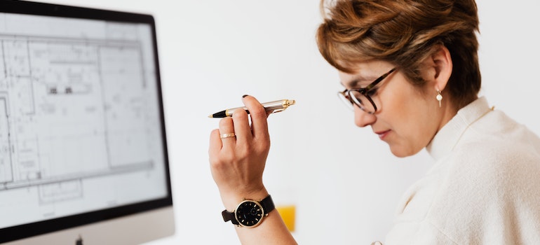 A woman making a decision between short-term vs. long-term Manhattan storage