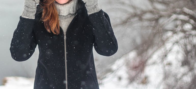 A woman wearing winter clothes