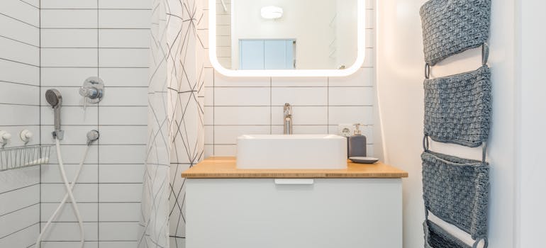 A small apartment bathroom with innovative storage solutions