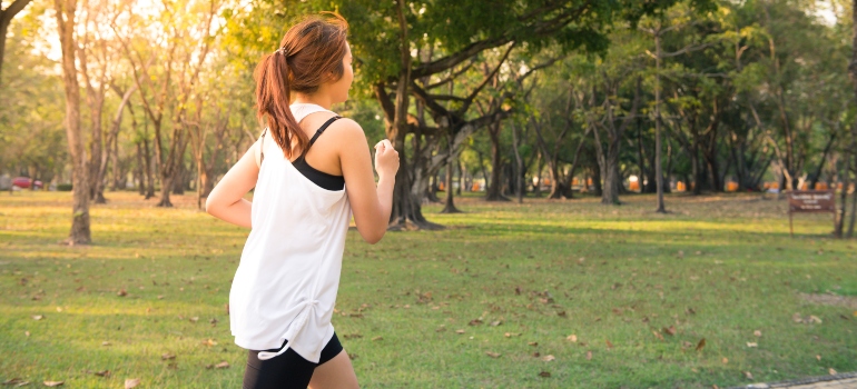A girl jogging in a park
