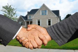 a handshake after home purchasing